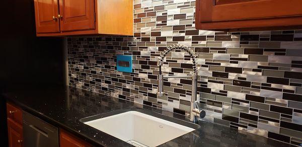 Installed kitchen backsplash.