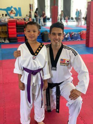 CJ & Master Nick after earning his purple belt.