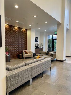 Lobby of the hotel with a coffee & water station - nice and clean