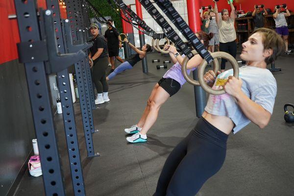 Group fitness. Ring rows. Fun workout class.