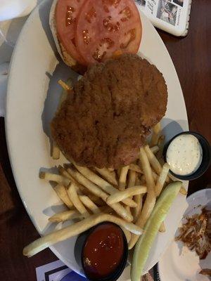 Spicy chicken sandwich and natural fries as a side