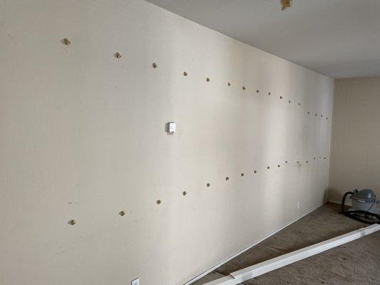 Interior wall insulation of an apartment unit. 
 
 Insulation injected into wall for noise reduction.