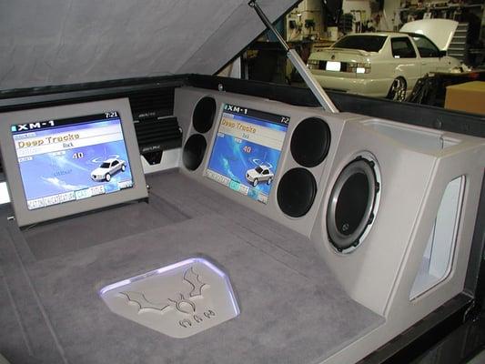 Flat panel monitors with custom fiberglas speaker enclosures in truck bed 1