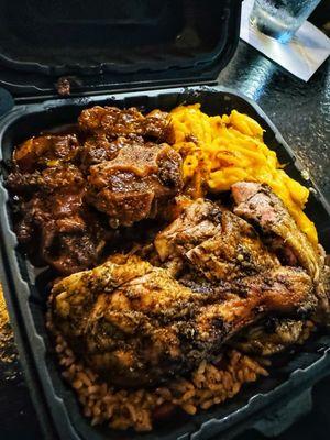 Jerk Chicken & Oxtail Combo w/ Mac n' Cheese & Peas n' Rice!....Double Thumbs Up!!  Seasoned and cook to perfection!