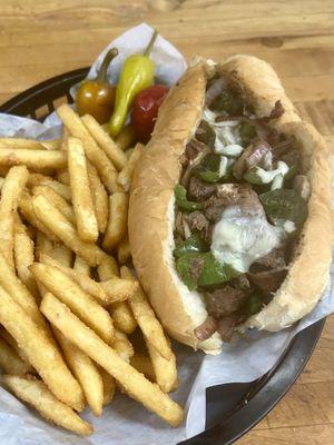 Philly Cheesesteak with fresh, sautéed onion, mushroom and bell pepper, topped off with provolone cheese.