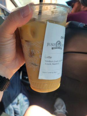 Medium iced oat milk latte with caramel and hazelnut