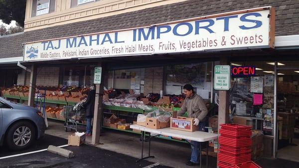 Produce on the sidewalk at Taj Mahal Imports.