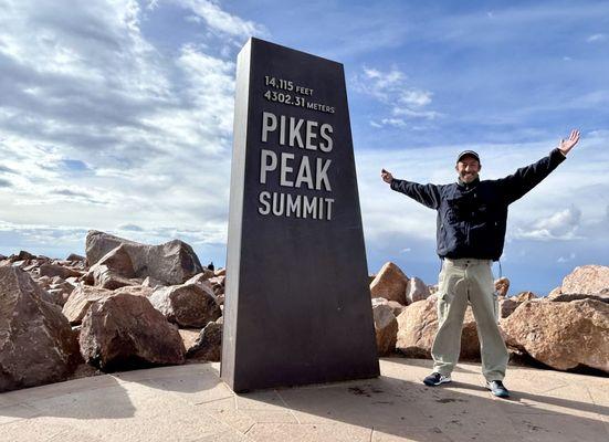 The summit statue standing at 14,115 feet.