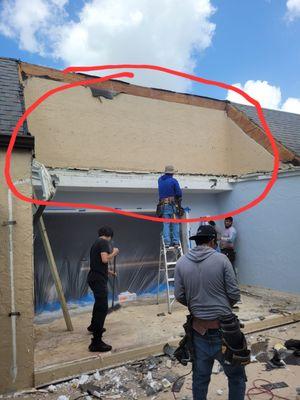 Stucco wall that was left behind and now embedded in the attic