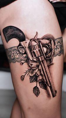 Black and grey revolver! Great details in the flowers and all over this tattoo it's just lovely