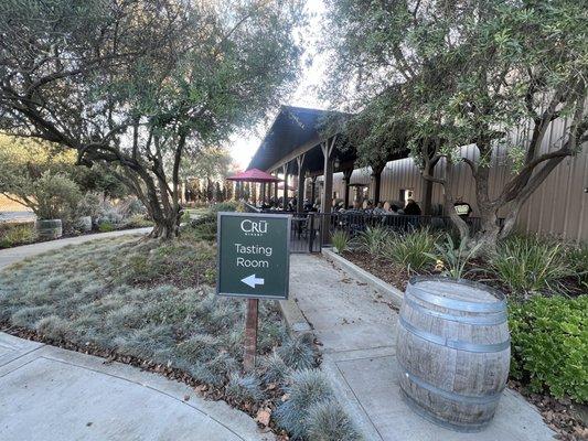 Along the path towards the tasting room with outdoor seating area in view