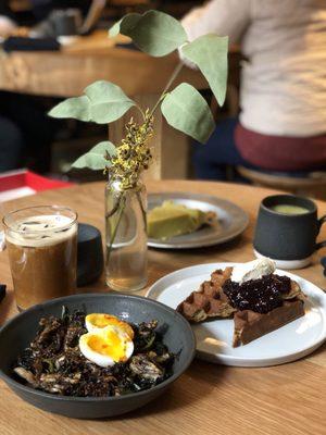 Sunset grains with soft boiled egg, waffle, pie, iced americano, and turmeric latte.