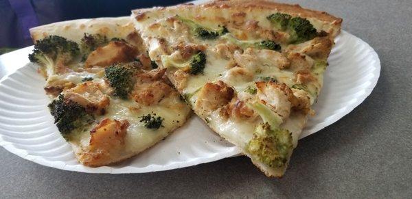 Chicken broccoli and Alfredo slices of pizza.