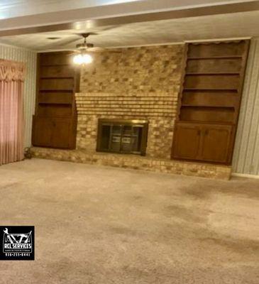 This is a fireplace area that a customer wanted painted . The. Went ahead and painted the cabinets too . 

This is a before picture.