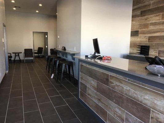 Elite Auto and Tires customer waiting area with color television, coffee and comfortable seating in a clean smkoe-free enviro...