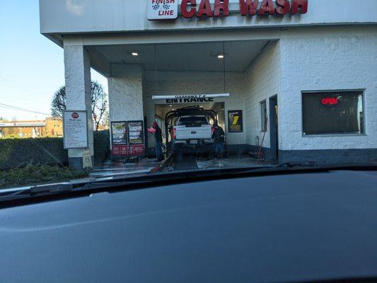 Two very enthusiastic and thorough attendants give your car a great wash even before the machine does