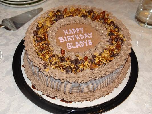 Yet another great ice cream cake! German chocolate with pecans, chocolate mousse, brownies, and toasted coconut flakes!