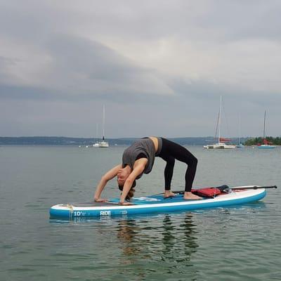 Paddle board yoga in harbor Springs michigan. Sup yoga is the future. Learn how to practice yoga on a stand up paddle board.