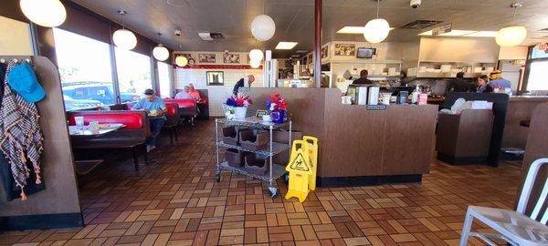 Hostess area in the middle and seating on the left.