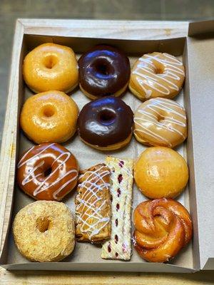 Cream cheese, cinnamon roll, 3 glazed, 2 chocolate glazed, 2 maple, 1 caramel and 2 danishes