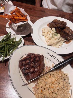 Butcher steak, rice pilaf, green beans, meatloaf, sweet potato fries, and mashed potatoes