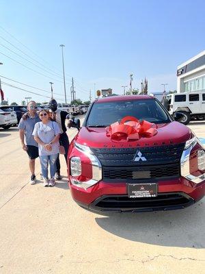 Samuel our salesman with us and our 2023 Mitsubishi Outlander.