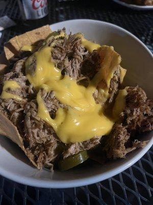 Piled high pork nachos