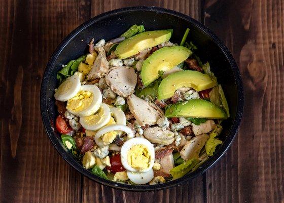 Cobb Salad
egg, avocados, bacon , grilled chicken, ,tomatoes, bleu cheese, on a bed of romaine and spinach