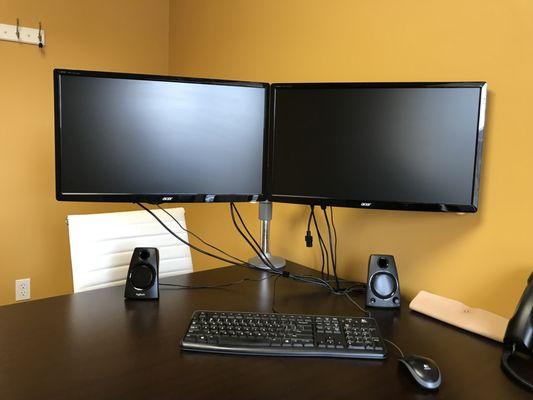 Dual monitor setup for your computer utilizing high quality Humanscale desktop monitor mounts!