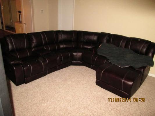 Biggest couch I've ever owned! My son (22 years old) getting comfortable ... look how huge this thing is! I LOVE IT!