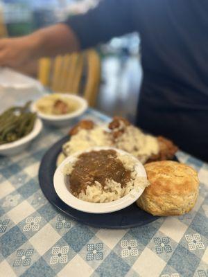 Pork Chop Blue Plate with rice and gravy, green beans and braised cabbage with bacon.