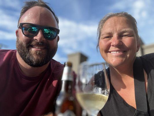 Enjoying our beverage from the bar out by the nice pool area