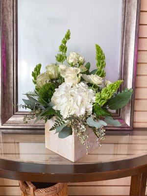 Cube arrangement with hydrangeas, roses, and bells of Ireland