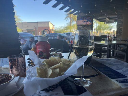 Chill patio area. Quieter for conversation and a nice breeze.