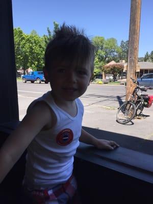 My son enjoying the open garage door windows on a beautiful day in C.O.