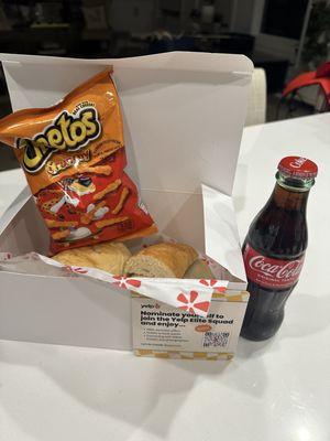 Coca Cola & subs! Don't forget to get a bag of chips!