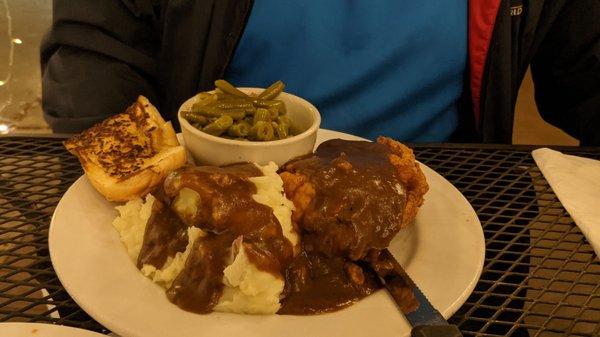 Smothered pork chops with mashed potatoes and southern green beans. Perfection!