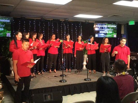 Choir singing and the youth doing praise and worship