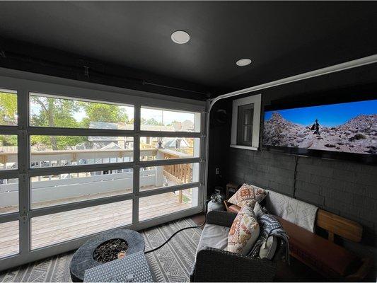 Aluminum full view door on second story balcony with motorized screen door