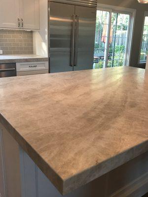 Beautifully cut 2.25" thick mitered edge taj mahal quartzite countertops.