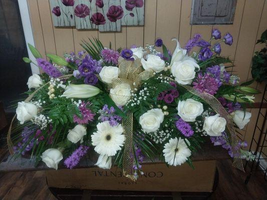 Purple and white casket spray