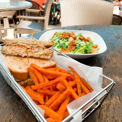 Fresh Caesar Salad & A Blackened Mahi Reuben with swiss cheese, 1000 island, cole slaw, and griddled rye.