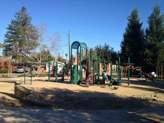 Play structure with sand around the perimeter