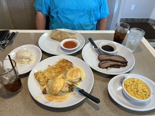 Southern pulled pork eggs Benedict, Chorizo burrito, Biscuits and Gravy Side, Smoked Beef Brisket & Mac & cheese.