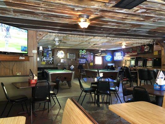 Pool tables and games behind eating area