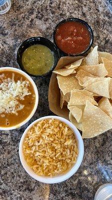 Side of beans, side of rice and chips and salsa from the salsa bar