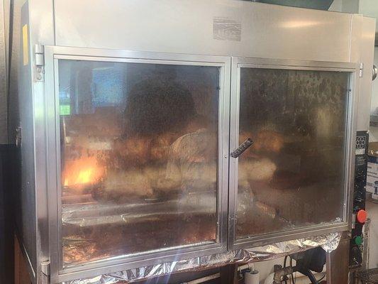 Fresh rotisserie chickens being made!