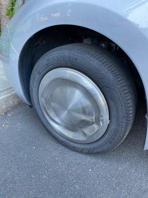 Wheel cover after going through the wash tunnel. They left my drivers door open in a poor attempt at hiding what had occurred.