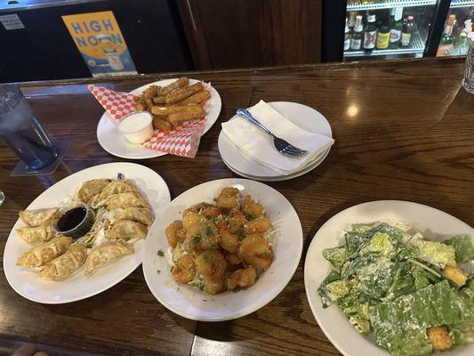 Pot stickers, Caesar salad, fried zucchini and sweet/spicy shrimp