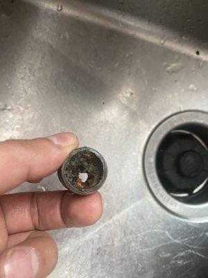 The part that was replaced. As you can see, in addition to the leak, it had a buildup, causing low pressure to my dishwasher.